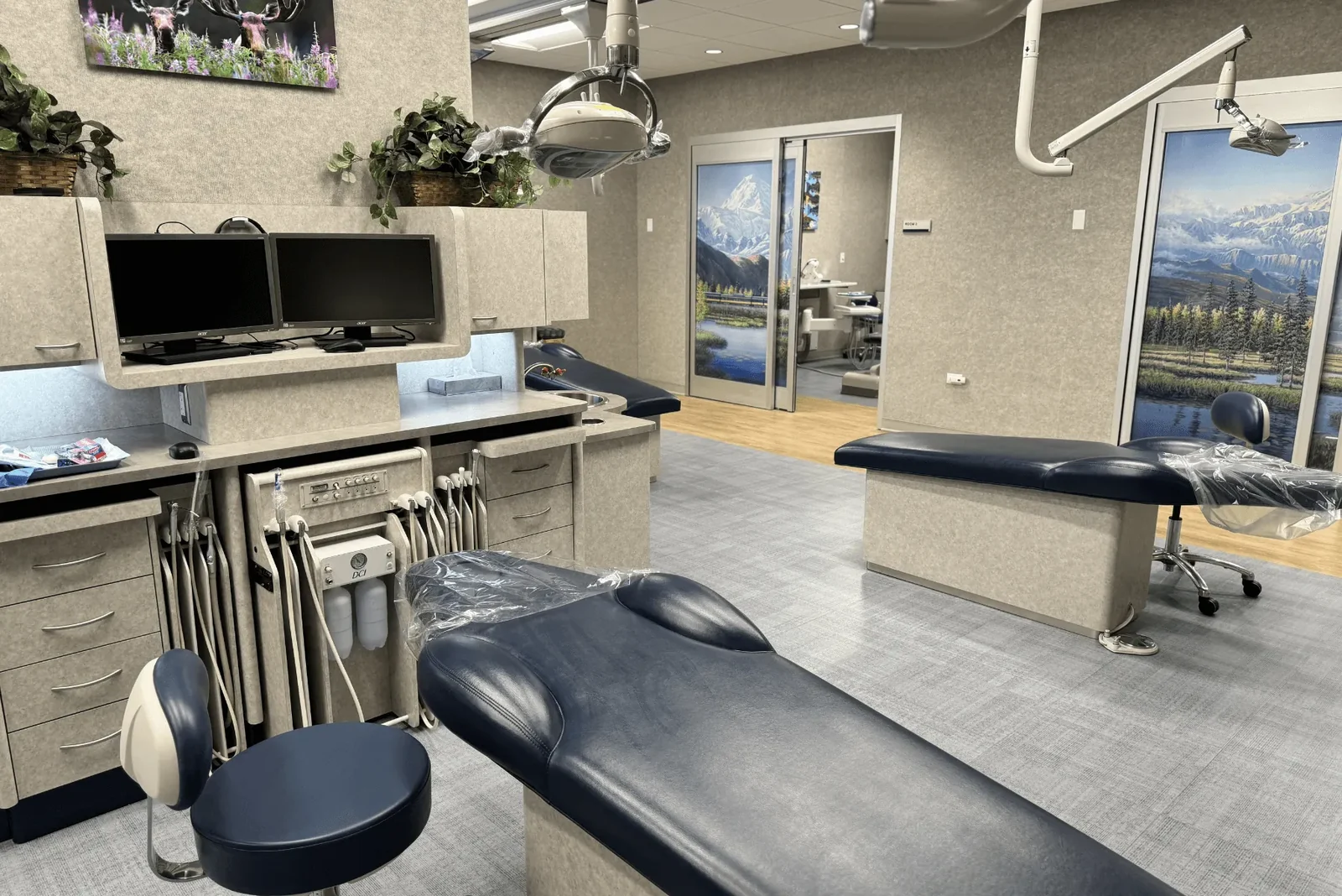Dental treatment chair beside cabinetry and equipment.