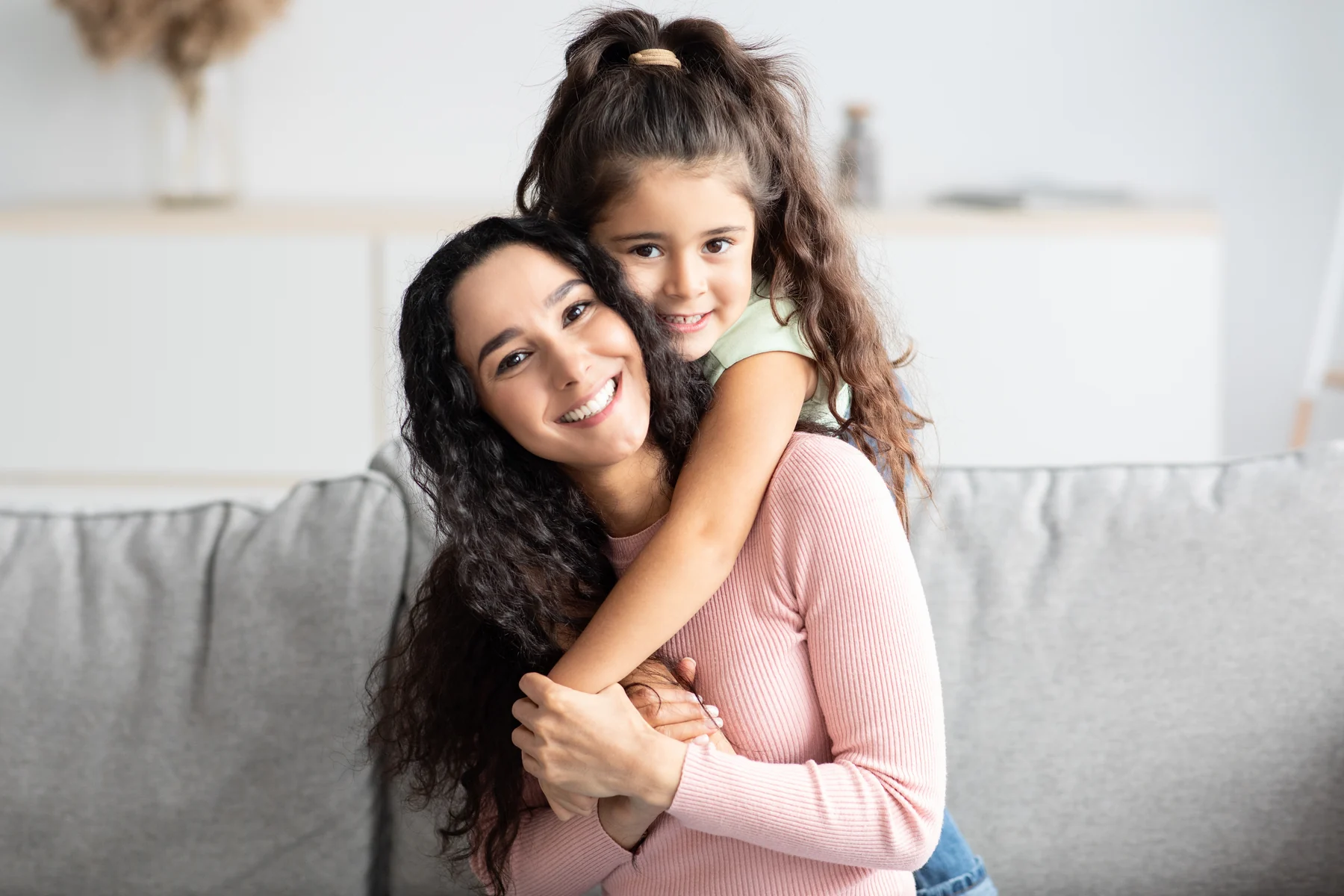 A mother and child smiling together for Dental Financing.