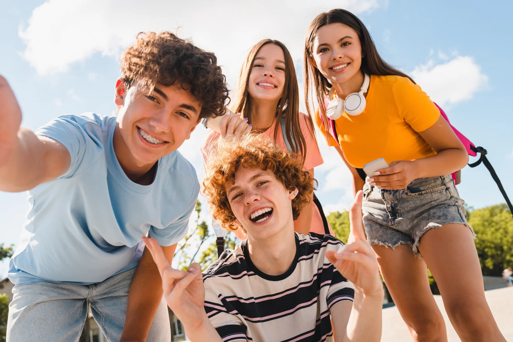 A group of smiling kids for What We Treat.